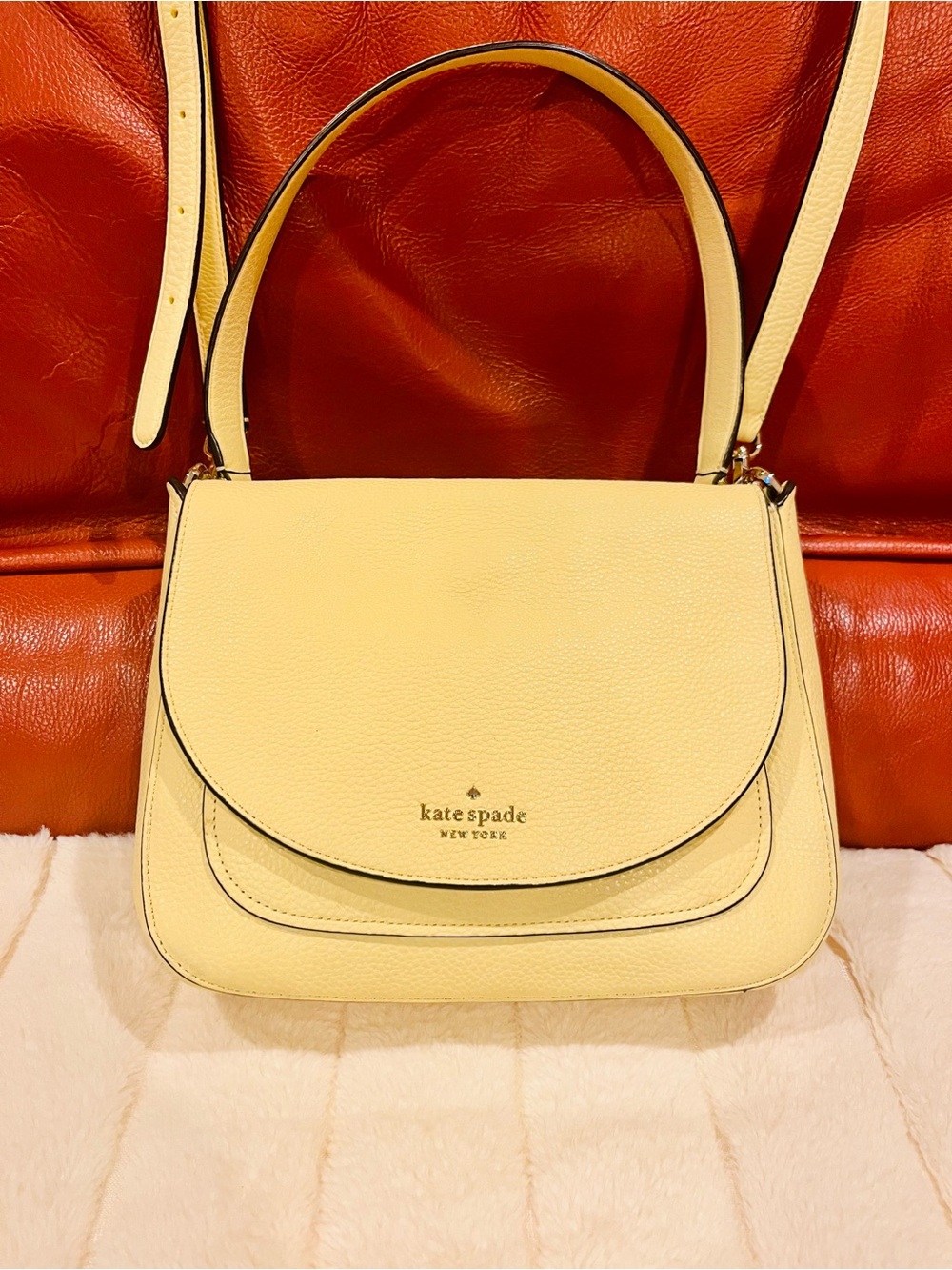kate spade lemon cream leather saddle shoulder bag